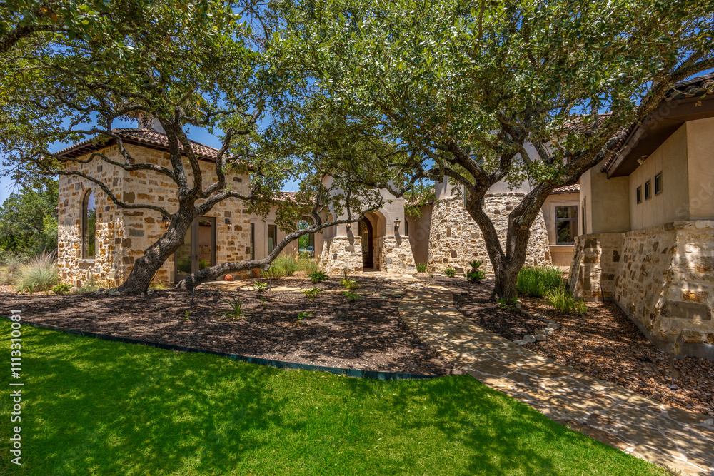 Naklejka premium Rustic charm of a sunlit courtyard nestled among ancient oak trees