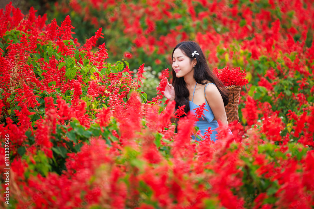 young woman very happy at the red flower garden. young woman very happy at the red flower garden.