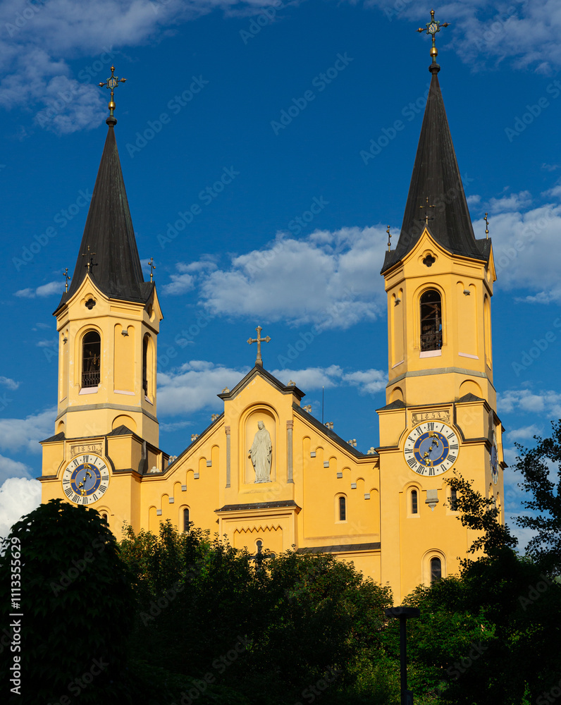 Fototapeta premium Close-up of Church of Assumption of Mary in Bruneck largest town in Puster Valley in Italian province of South Tyrol