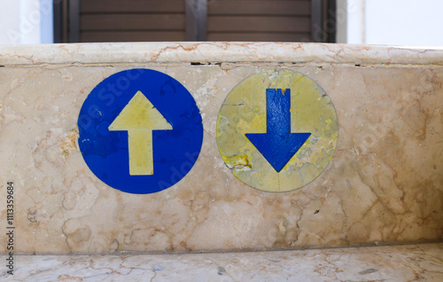 terrace stairs floor with up and down arrows to make it easier for pedestrians photo