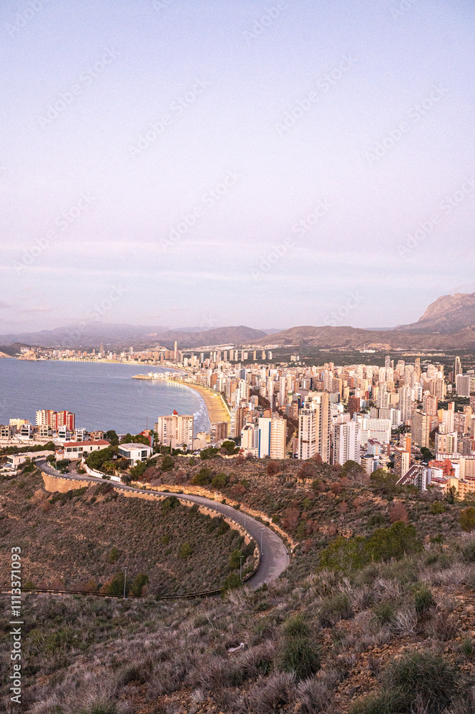 Panorama in the Sunrise on a clear day over Benidorm in Spain from the Mirador de la Cruz.