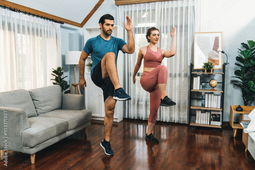 Obraz premium Athletic and sporty fitness couple or exercise buddy running posture at home body workout exercise session for fit physique and healthy sport lifestyle at home. Gaiety home exercise workout training.