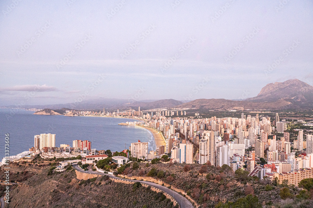 Panorama in the Sunrise on a clear day over Benidorm in Spain from the Mirador de la Cruz.