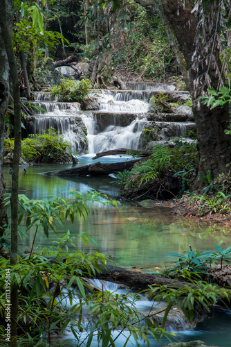 Scenic deep forest waterfalls at Erawan water falls national park, in Thailand