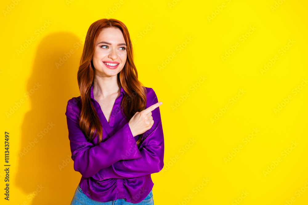 Photo portrait of attractive young woman look point empty space dressed stylish violet clothes isolated on yellow color background Photo portrait of attractive young woman look point empty space dressed stylish violet clothes isolated on yellow color background