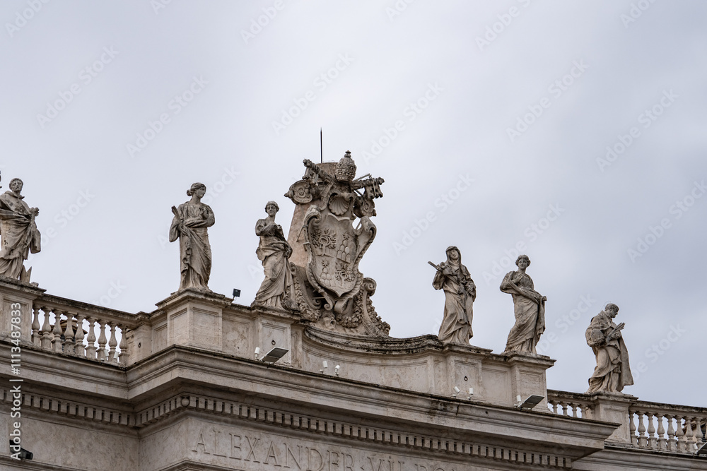 Statues on colonnades on St. Peter's Square in Vatican, Rome against Statues on colonnades on St. Peter's Square in Vatican, Rome against
