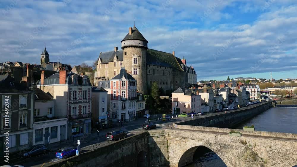 The famous Laval Castle and the old bridge on a beautiful daytime, Laval, Mayenne, France. The famous Laval Castle and the old bridge on a beautiful daytime, Laval, Mayenne, France.