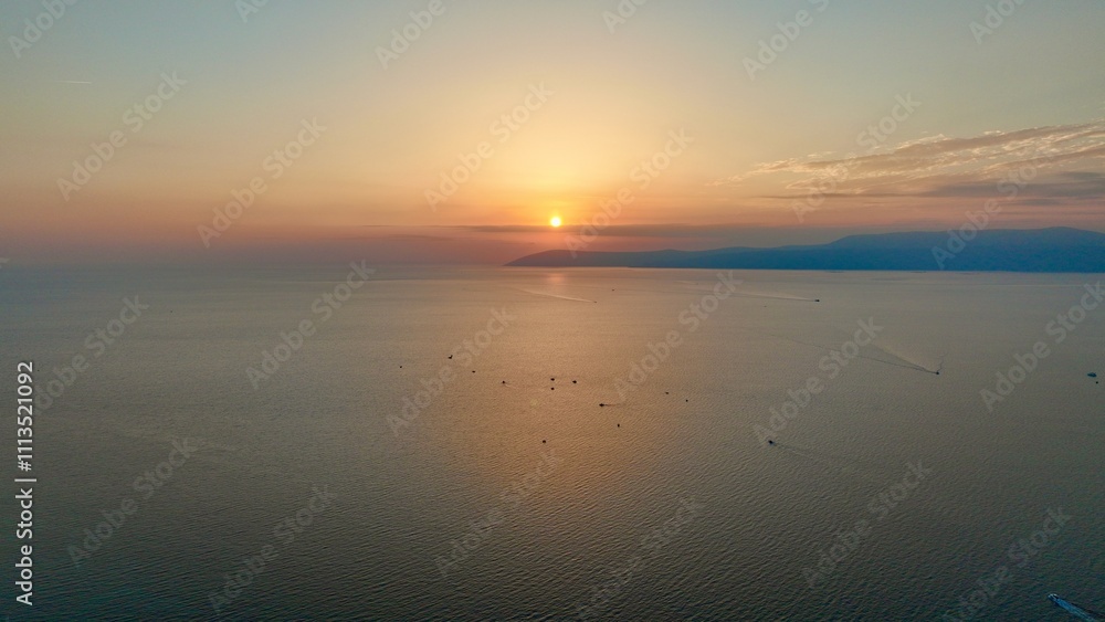 Sunset and seascape - high quality image of the sunset over the sea captured by drone. Sunset and seascape - high quality image of the sunset over the sea captured by drone.