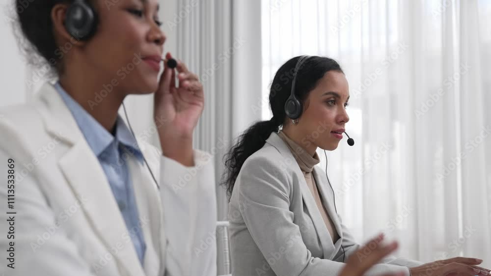 Business people wearing headset working in office to support remote customer or colleague. Call center, telemarketing, customer support agent provide service on telephone video conference call crucial Business people wearing headset working in office to support remote customer or colleague. Call center, telemarketing, customer support agent provide service on telephone video conference call crucial