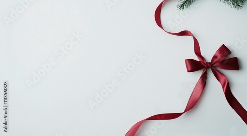 Elegant red ribbon displayed on a white background for gift wrapping or decor...