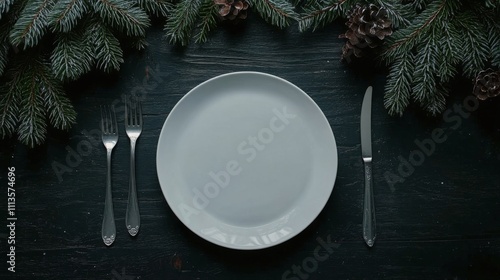 Elegant white plate arranged with utensils on dark wood background decorated ...