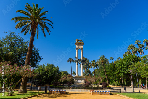 Seville, Spain - August 01, 2024: Murillo Gardens and Christopher Columbus Monument in Seville. photo