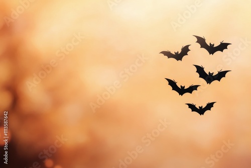 Bats flying against a sunset colored sky in the evening twilight hours
