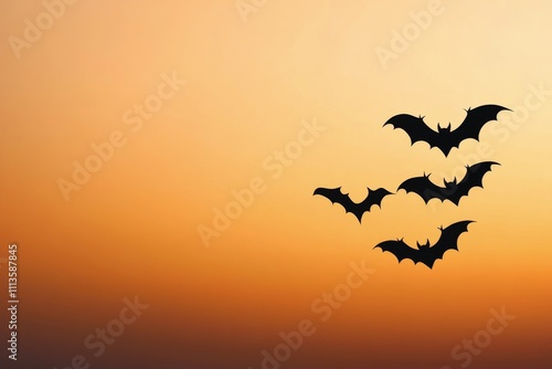 Bats flying against a colorful sunset sky during twilight hours in nature