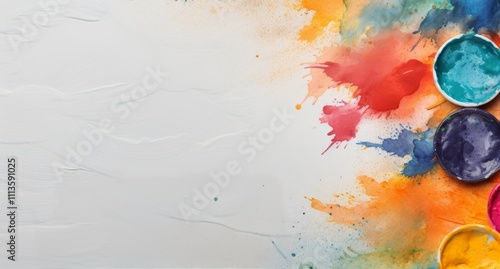 Colorful watercolor paints and brushes arranged on a vibrant artistic background
