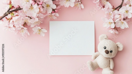 Elegant spring blossoms gently framing a blank card on a soft surface