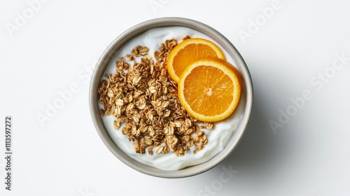 Healthy breakfast bowl with yogurt, granola, and fresh orange slices for a re...