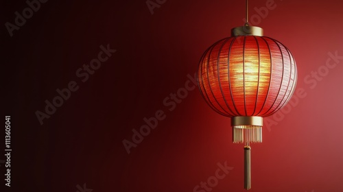 Elegant red lantern hanging against a vibrant wall with warm illumination