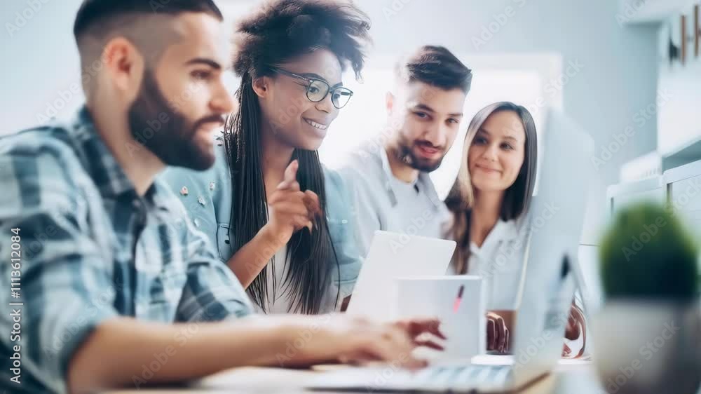 A diverse group of creative people working together in an office A diverse group of creative people working together in an office