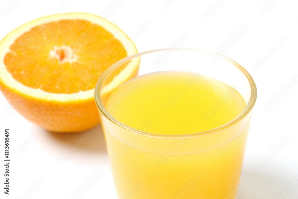 Glass of freshly squeezed orange juice on the table with citrus fruits Glass of freshly squeezed orange juice on the table with citrus fruits