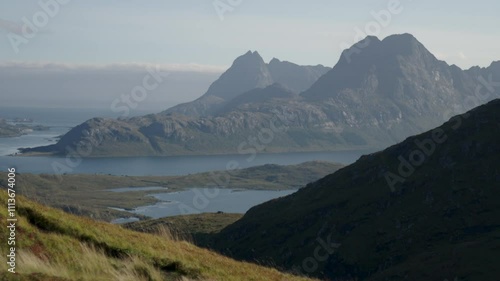 Slow motion grass and mountains