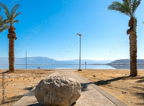 Dead Sea, salty shore, caution sign for not safety swimming