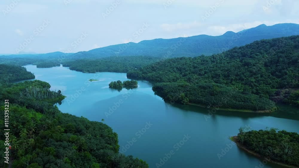 Beauty of nilgiri , Areal view of a Beautiful reservoir dam in Kerala, India, Morning view of Neyyar dam, Mountains and small green islands are seen in this video Beauty of nilgiri , Areal view of a Beautiful reservoir dam in Kerala, India, Morning view of Neyyar dam, Mountains and small green islands are seen in this video