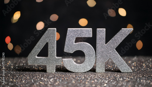 45k followers celebration. Silver text. Social media achievement. Black glittering backdrop. photo