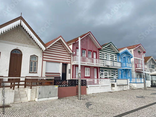 Colorful facades of houses along the streets of Costa Nova, Aveiro, showcasing the vibrant and picturesque architecture