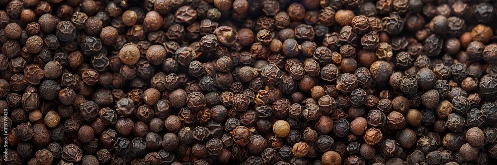 Close-up fiew of whole black peppercorns. Abstract food texture. Close-up fiew of whole black peppercorns. Abstract food texture.
