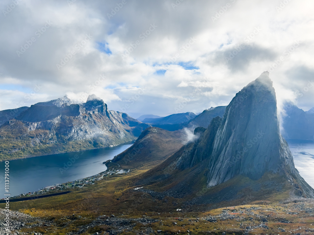Stunning autumn landscape of Segla Mountain in Senja Island, Northern Norway, with dramatic cliffs and fjords. Stunning autumn landscape of Segla Mountain in Senja Island, Northern Norway, with dramatic cliffs and fjords.