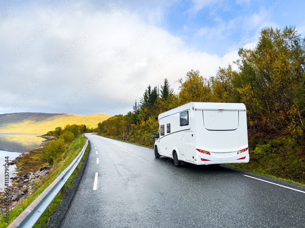 Motorhome and autumn landscape of Senja Island, Northern Norway, with colorful trees, serene water reflections, and dramatic mountains. Motorhome and autumn landscape of Senja Island, Northern Norway, with colorful trees, serene water reflections, and dramatic mountains.