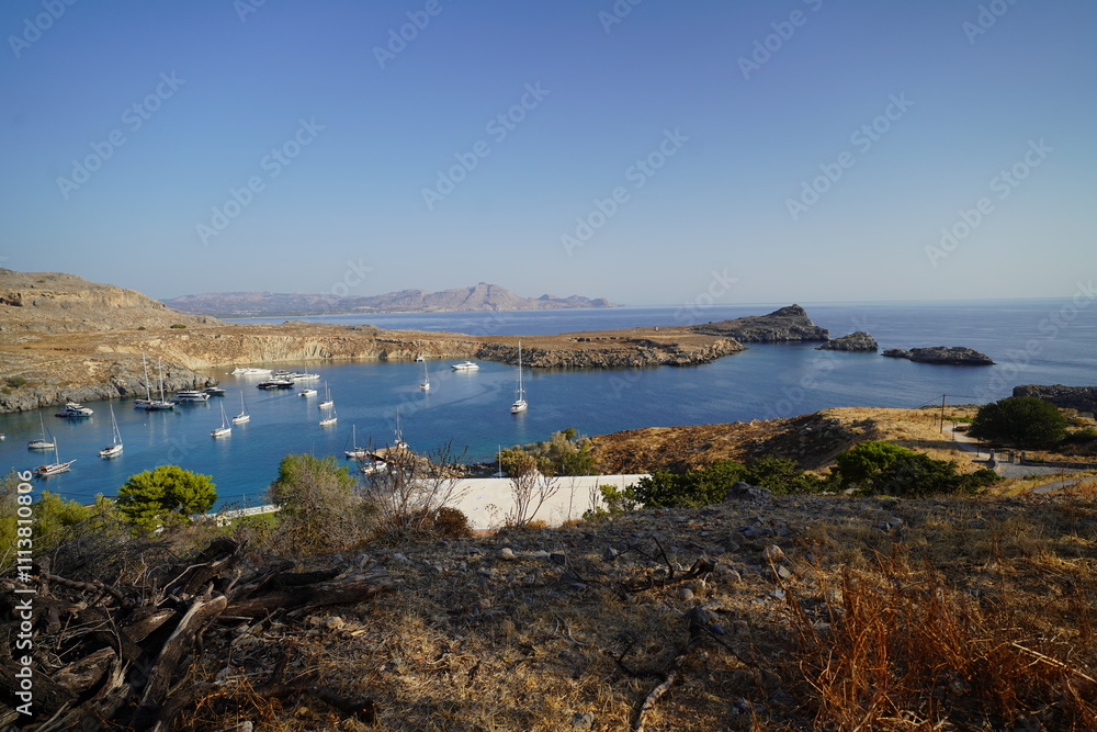 panoramic view of Lindos bay with boats panoramic view of Lindos bay with boats