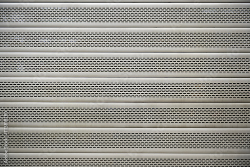 Stainless steel metal shutter with small horizontal perforations