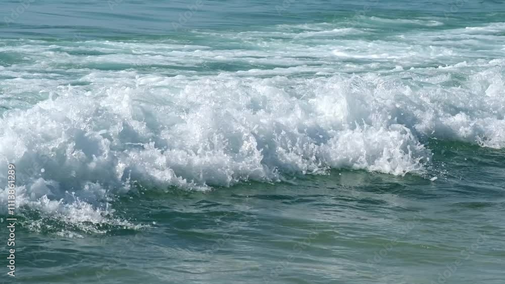 Close-up of mesmerizing ocean waves on the shore. The concept of natural beauty, relaxation and travel. Close-up of mesmerizing ocean waves on the shore. The concept of natural beauty, relaxation and travel.