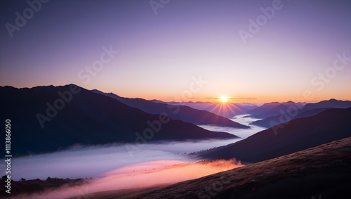 Breathtaking sunrise over a misty valley surrounded by majestic mountains. Epic landscape photography concept