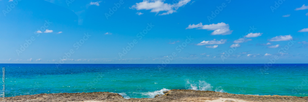 The ocean is calm and the sky is clear The ocean is calm and the sky is clear