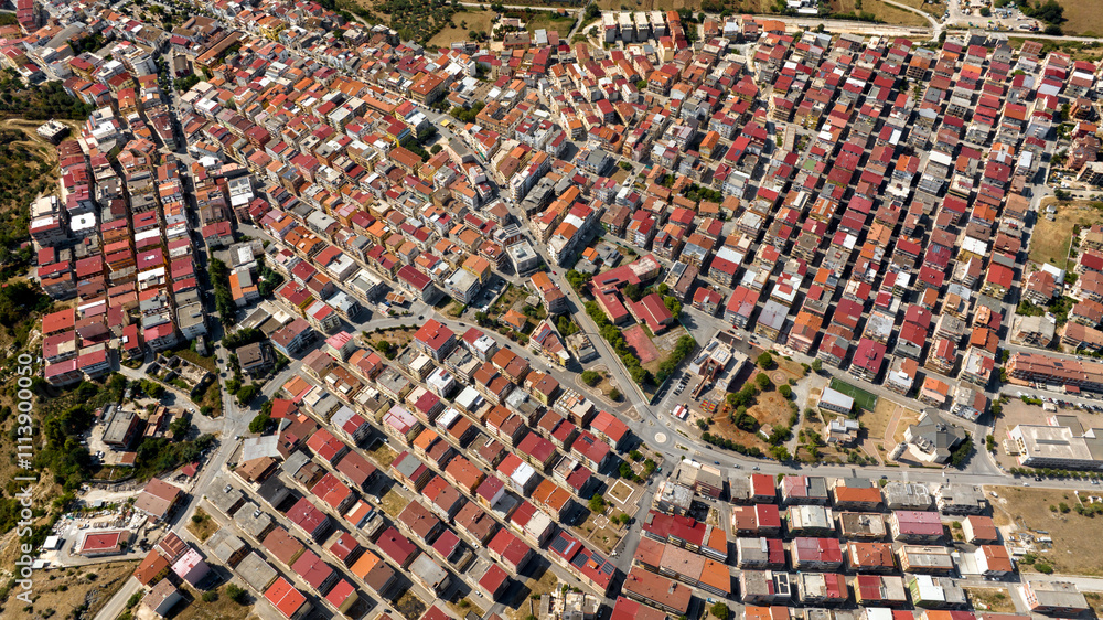 Aerial view of houses, apartments and buildings of the town of Cagnano Varano located in the province of Foggia, in Gargano, Puglia, Italy. Aerial view of houses, apartments and buildings of the town of Cagnano Varano located in the province of Foggia, in Gargano, Puglia, Italy.