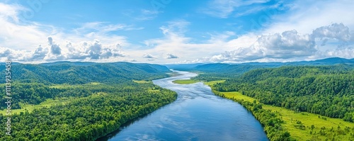 A panoramic view of a wide river with several tributaries merging, creating complex ripples, forested hills stretching into the distance