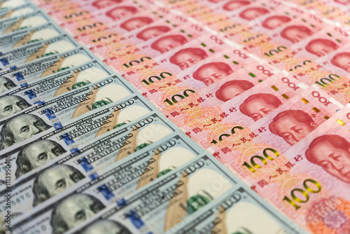 Chinese currency yuan and U.S. dollars amerkinaische bills. concept of west versus east. The confrontation of superpowers. The Chinese economy versus the United States. photo