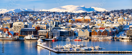 Tromso harbor with houses, fjord, cruise ships and downtown on sunny winter day Norway travel