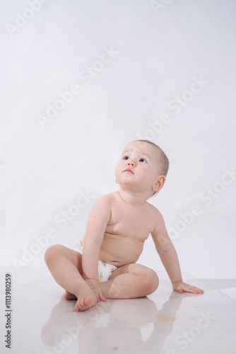 a one-and-a-half-year-old girl on a white background