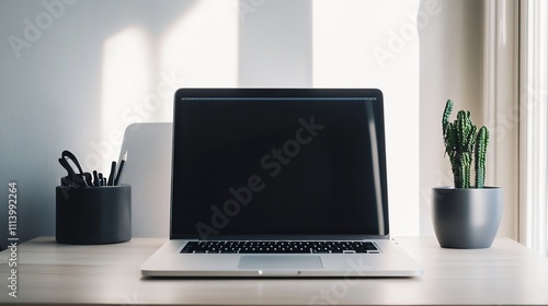 Wallpaper Mural A laptop sits on a desk with a plant, a lamp, and a coffee mug. Torontodigital.ca