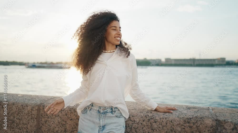 Happy Hispanic young woman in beautiful harbor, girl on embankment, portrait. Medium shot with pretty mixed-race lady resting on city quay near sea, traveling in summer vacation, positive emotions Happy Hispanic young woman in beautiful harbor, girl on embankment, portrait. Medium shot with pretty mixed-race lady resting on city quay near sea, traveling in summer vacation, positive emotions