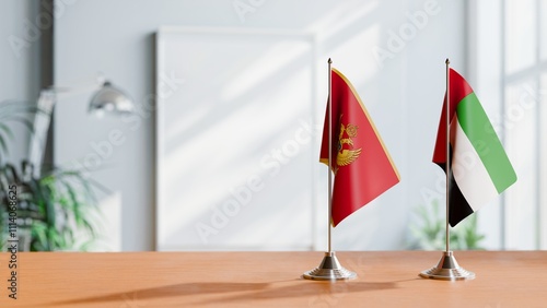 FLAGS OF MONTENEGRO AND UAE ON TABLE