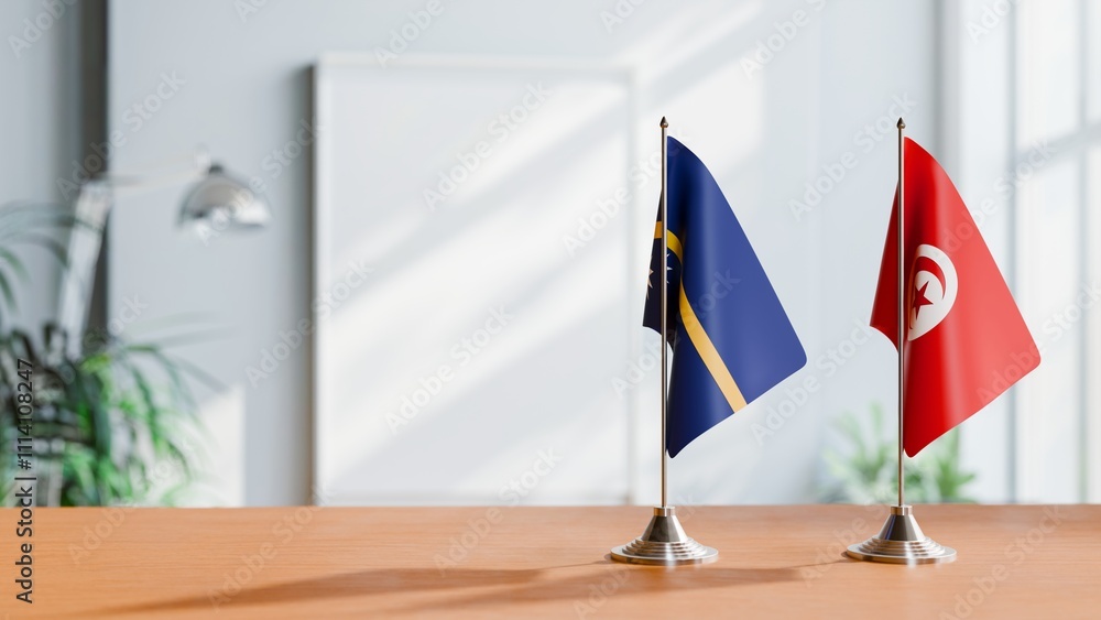 FLAGS OF NAURU AND TUNISIA ON TABLE FLAGS OF NAURU AND TUNISIA ON TABLE