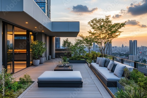 Modern rooftop terrace overlooking city skyline at sunset