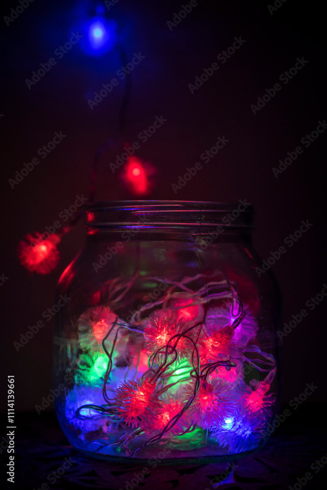 Colourful New Years lamps as decoration in a jar Colourful New Years lamps as decoration in a jar