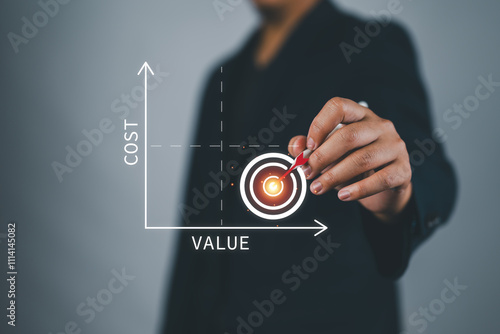 Cost benefit analysis. Concept about the relationship between Low Cost and High Value. Man tick target photo