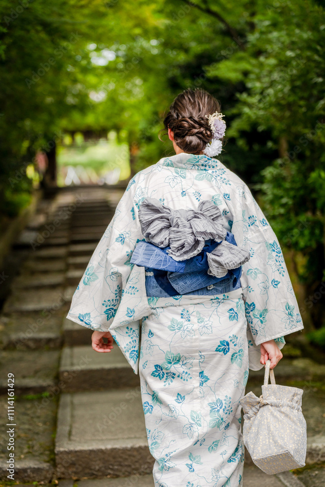 Woman wearing Yukata Kimono in Kyoto, Japan. Japanese traditional background. Woman wearing Yukata Kimono in Kyoto, Japan. Japanese traditional background.